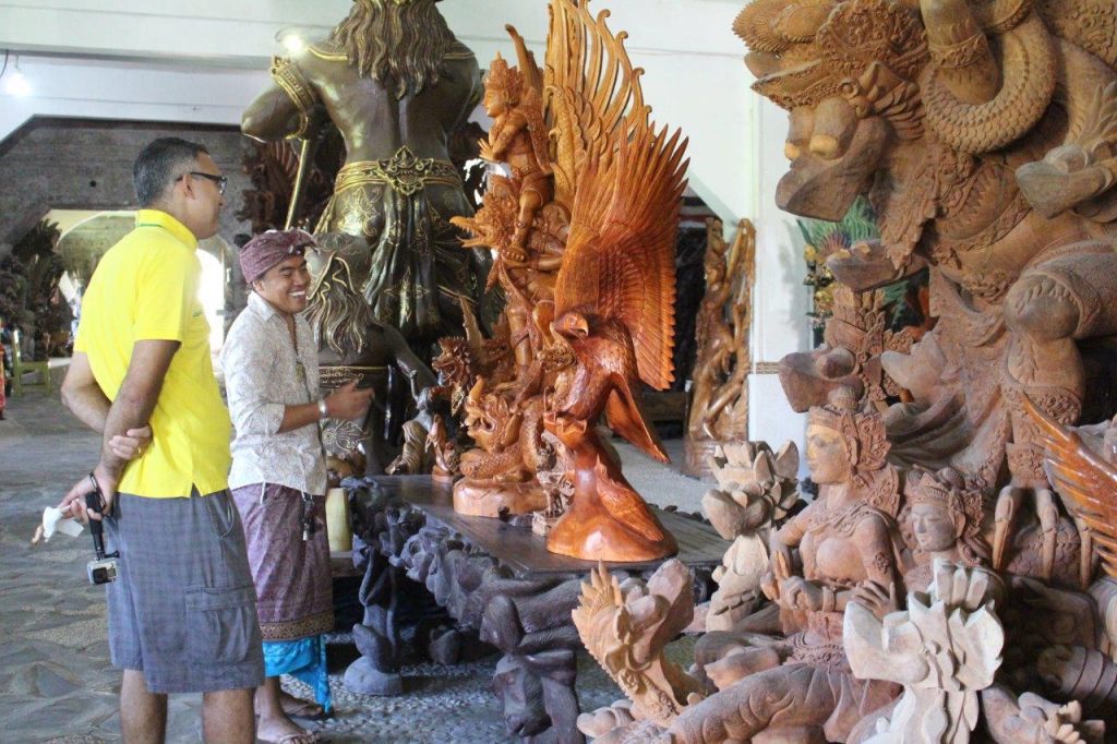 Wood carving in I Made Ada, in Bali