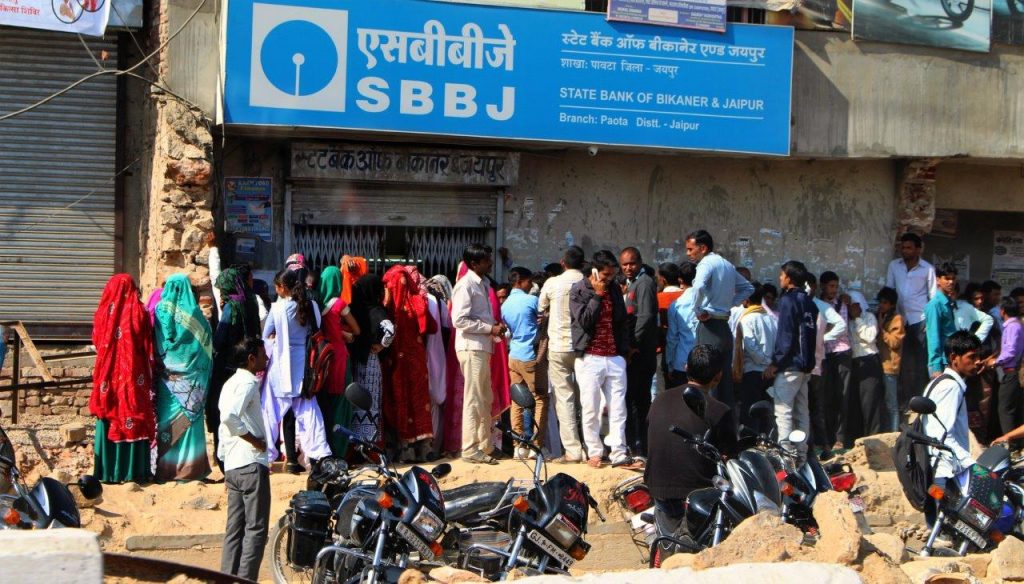 The banks are always full of people queueing to withdraw money in India